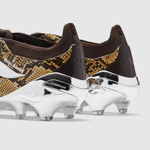 adidas Predator Elite Tongue soccer cleats in black with white accents, designed for firm ground play, by Wales Bonner.