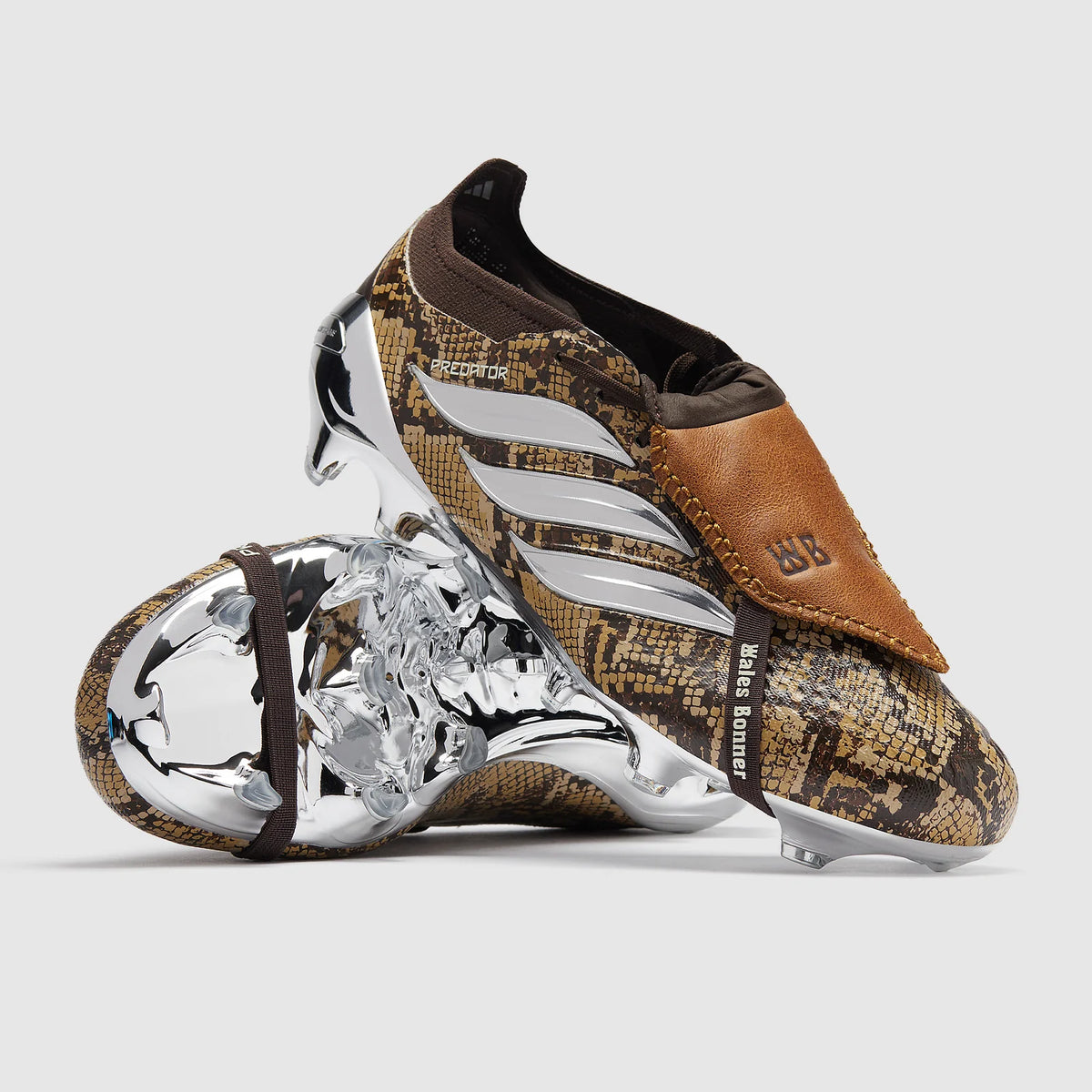adidas Predator Elite Tongue Wales Bonner FG soccer cleats showing black and red design with textured upper and firm ground studs