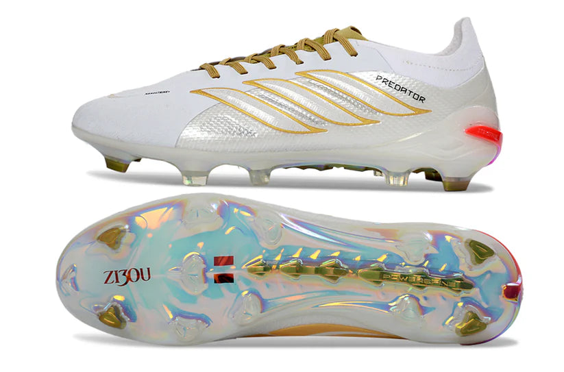 Adidas Predator x Elite FG white and gold soccer cleats with textured upper and firm ground studs for optimal grip.