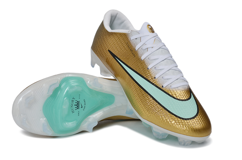 Nike Mercurial Superfly Kylian Mbappé soccer cleats in gold, white, and mint green featuring sleek design and lightweight construction.