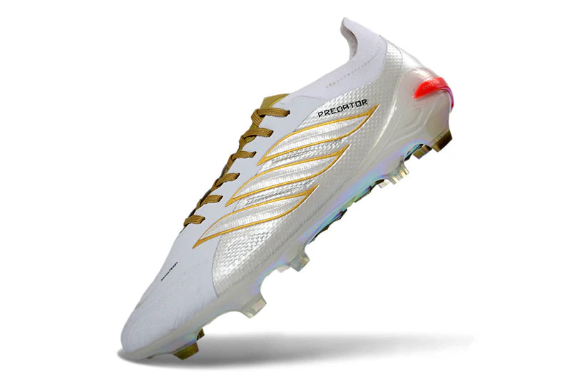 Adidas Predator x Elite FG white and gold soccer cleats with white laces and textured sole for optimal grip on the field
