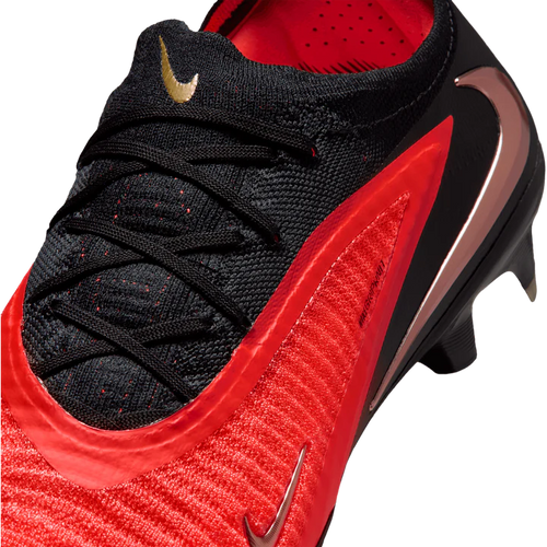 Nike Phantom 6 Low Elite FG soccer cleats in vibrant Aurora color, designed for optimal grip and agility on the field.
