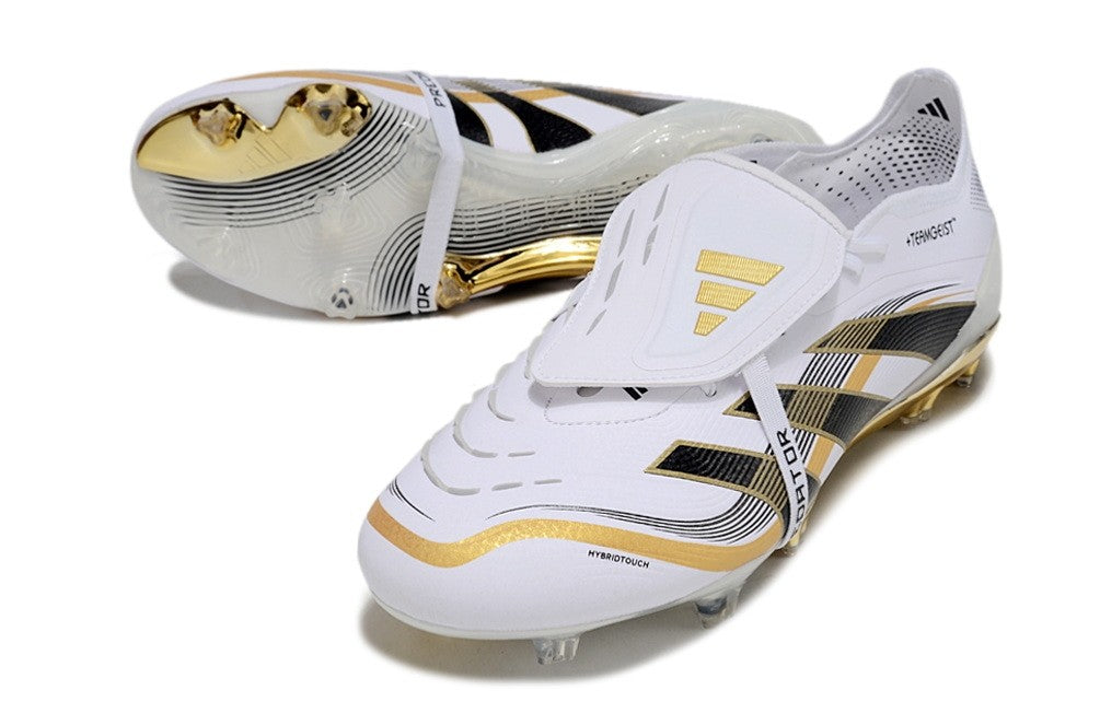 Adidas Predator Teamgeist Pack Elite FG soccer cleats in white, black, and metallic gold with a firm ground sole and tongue design.