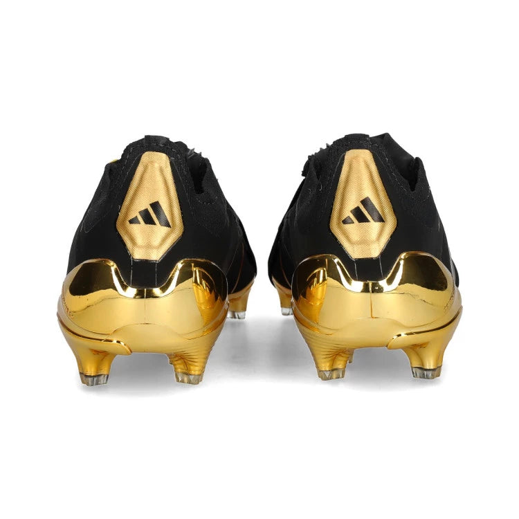 Jude Bellingham x adidas Predator Elite FT FG soccer cleats in black and gold, featuring textured upper and firm ground sole.