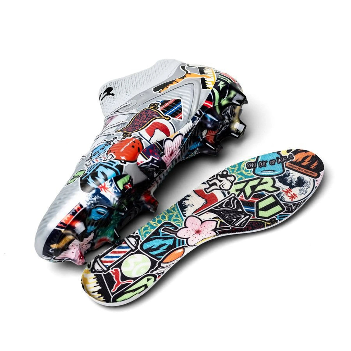 Unisport x PUMA Future 8 Ultimate FG soccer cleats with stickerbomb silver, black, red, and ultra blue accents on a white background.