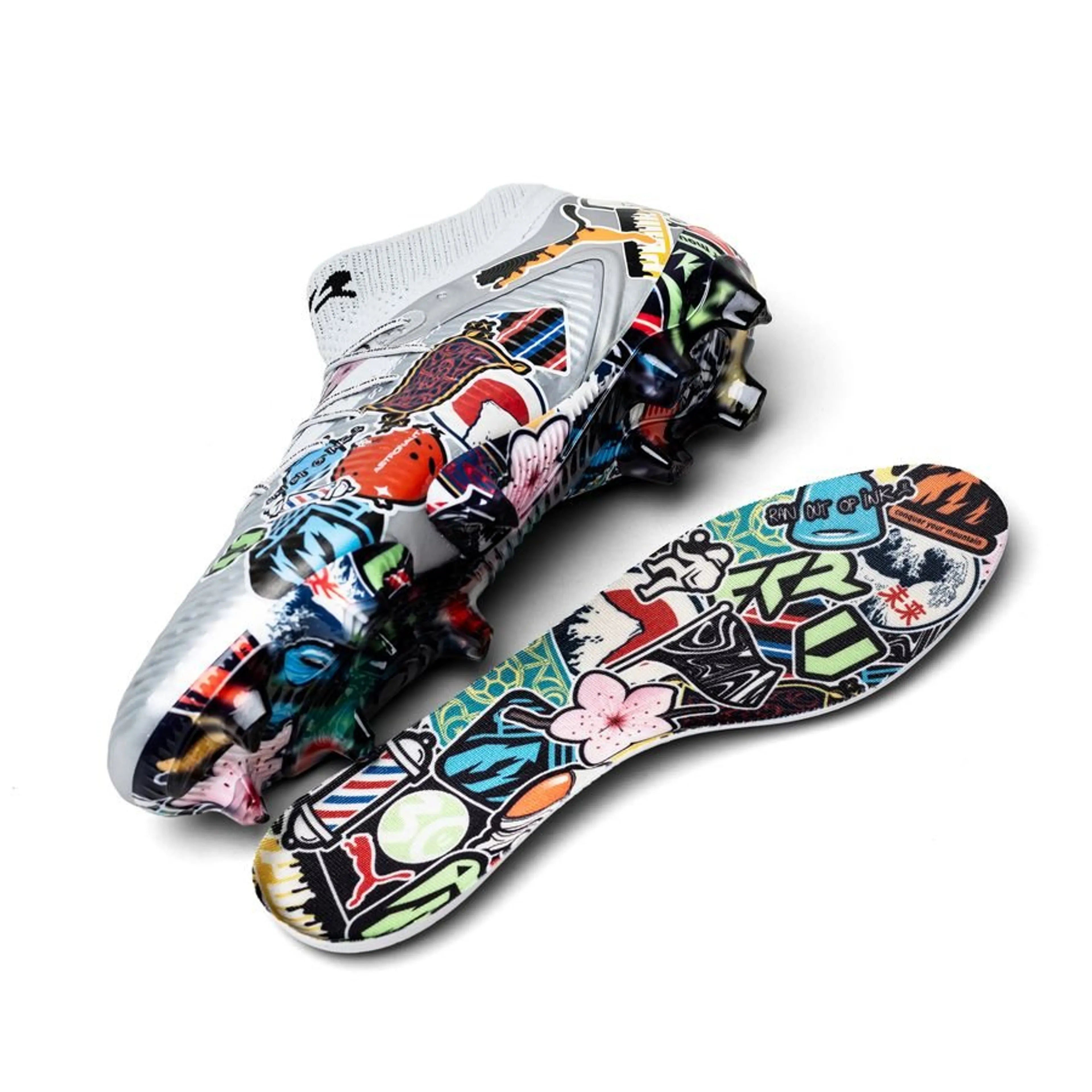 Unisport x PUMA Future 8 Ultimate FG soccer cleats with stickerbomb silver, black, red, and ultra blue accents on a white background.