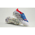 Jude Bellingham x adidas Predator Elite FG white soccer cleats on a lifestyle background, showcasing the design and branding details